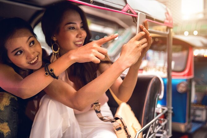 Bangkok Tuk-Tuk Tour by Night with Chinatown Street Food Meal - Wat Arun lit across the Chao Phraya
