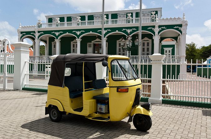 Curacao TukTuk City Tour - Queen Wilhelmina Park and the DUSHI sign