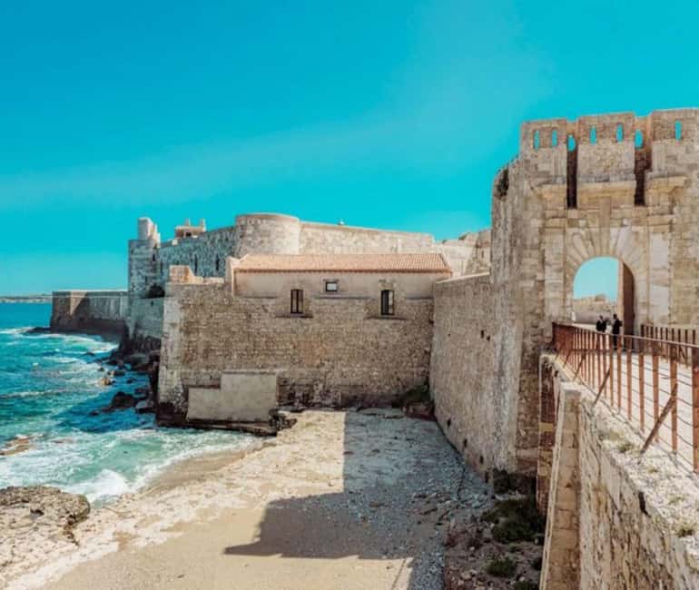Discover the wonders of Ortigia: a Tuk-Tuk tour through history and the sea. - Mitoraj’s sculpture and Santa Lucia alla Badia