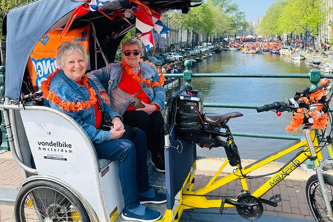 Explore Amsterdam in 75 Minutes – Pedicab Rickshaw City tour - Starting at Muntplein and getting your bearings