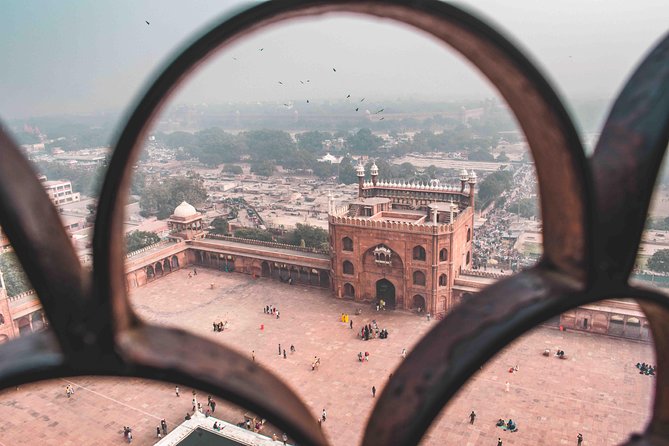Guided 3‑hour rickshaw ride through Old Delhi with transfers - Kinari Bazaar and Naughara’s old lanes