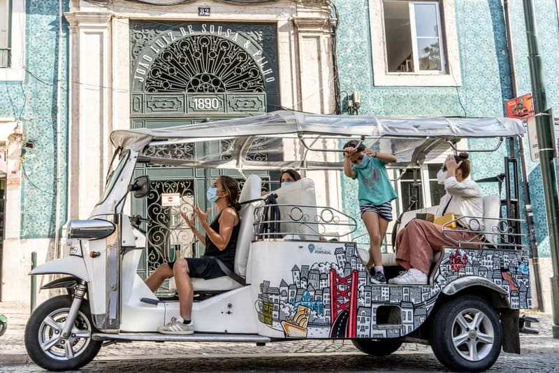 Lisbon: Food Tasting Tour by Tuk Tuk with 2 Stops - The first tasting: wine and a Portuguese bite