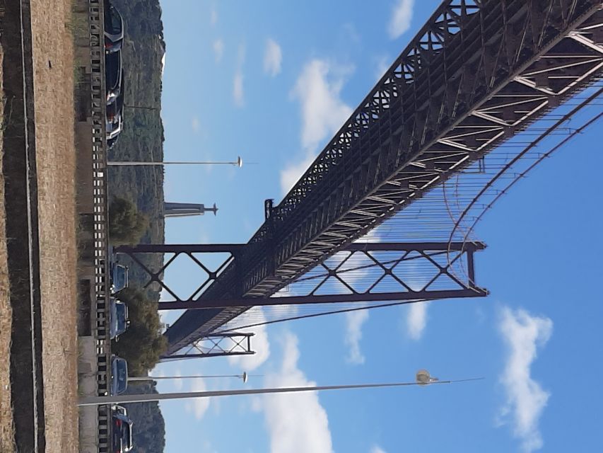 Lisbon: Private Tuk Tuk Tour Christ the King & Abril Bridge - Returning across the bridge
