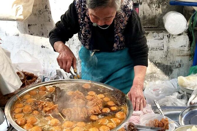 Luang Prabang Evening Food Tour by Tuk-Tuk - Market food, rice noodles, and coconut pancakes