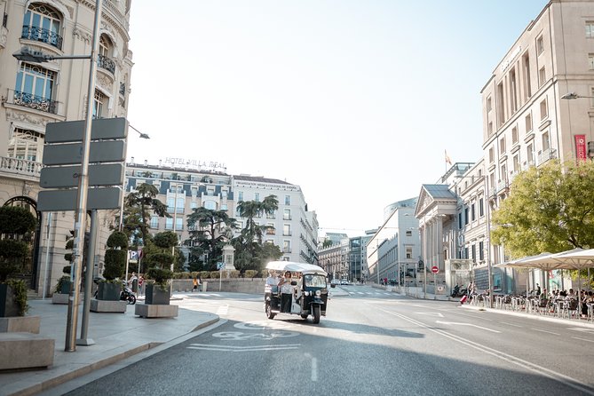 Madrid Express Tour with Local Guide in Eco Tuk Tuk Private - Puerta de Alcalá and the eastern edge of the center