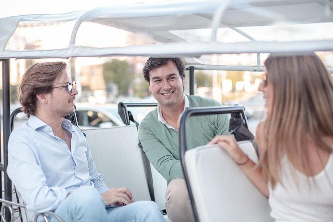 Madrid Welcome Tour with Local Guide in Eco Tuk Tuk Private - Puerta de Alcalá and the Bank of Spain