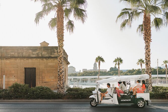 Malaga Expert Tour with Local Guide in Eco Tuk Tuk Private - La Malagueta Beach shows Malaga’s seaside side