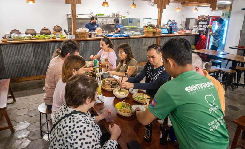 Phnom Penh: Evening Food Tour with Drinks & Tuk Tuk Included - From the riverfront to a family kitchen near the Royal Palace