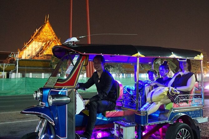 Private Bangkok Night City Tour by Tuk-Tuk with Thai Food - Wat Arun under the evening lights