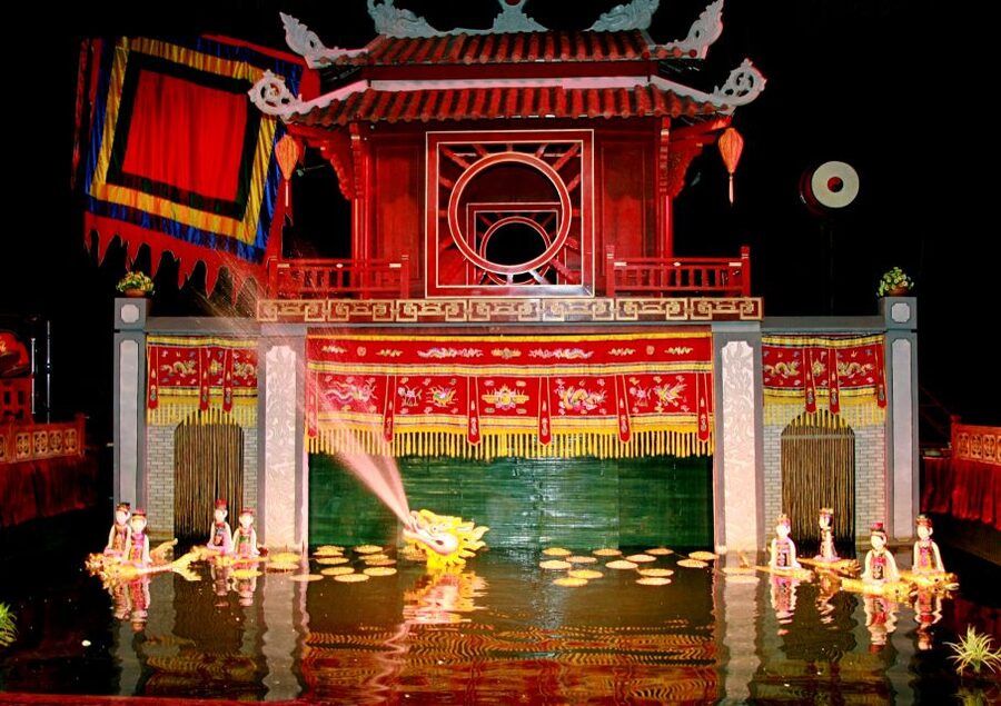 Private Evening Cyclo Tour with Water Puppet Show - Walking the Old Quarter for chicken noodles and egg coffee