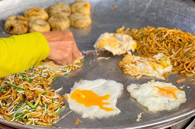 Siem Reap: Local Street Food Experience by Tuk-Tuk - The night market, from sweet desserts to fried insects