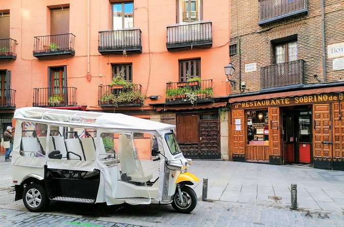 Tour of Castizo Madrid with a private guide in a yellow Tuk-Tuk - San Miguel Market and Cervantes
