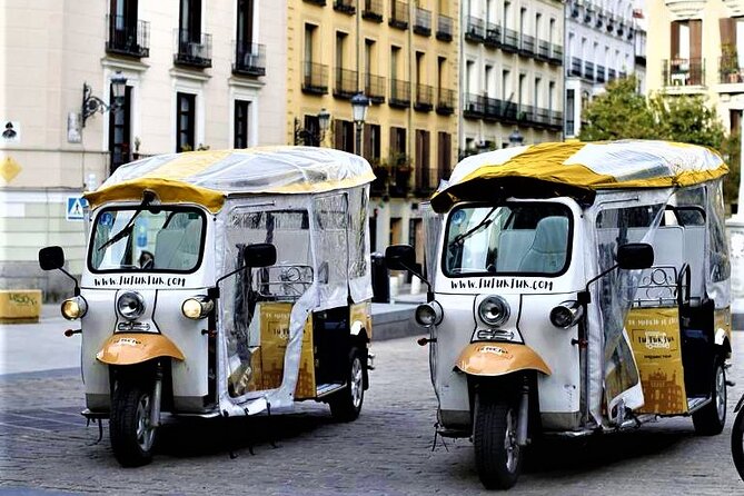 Tour of Historic and Modern Madrid with a guide in a yellow tuk tuk - From Plaza de Isabel II to Madrid Cathedral